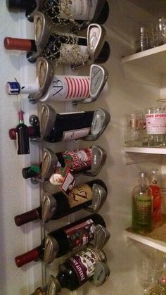 an organized wine rack in the corner of a kitchen