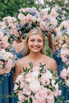 the bride and her bridesmaids are holding their bouquets in front of them