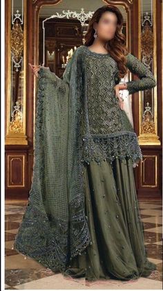 *Brand Name*     *MARIA B * *ORGANZA/NET*       *FABRIC DETAILS *  (SHIRT) ...ORGANZA (DUPATTA)ORGANZA (TROUSER) MALAI & NET *EMBROIDERY DETAILS* *FRONT*  EMBROIDERED *with stones handwork & cutwork* *NECK*  EMBROIDERED *with stones handwork* *FRONT*  BORDER EMBROIDERED *with stones handwork* *BACK* EMBROIDERED BACK BORDER EMBROIDERED *SLEEVES* EMBROIDERED SLEEVES BORDER EMBROIDERED *DUPATTA * EMBROIDERED *with 4 side embroidered border* *GHAGRA*  EMBROIDERED  *BEST QUALITY IS OUR TOP PRIORITY* The model picture is only for reference you will get the dress as shown in unstitch pic. This dress will be make to order according to your size (your given measurements) and will be ready to ship in 4 to 5 weeks. Festive Glamorous Lehenga With Dabka Work, Glamorous Dabka Work Lehenga For Festive Occasions, Glamorous Festive Lehenga With Dabka Work, Glamorous Lehenga With Dabka Work For Festive Occasions, Green A-line Wedding Dress, Festive A-line Wedding Dress, Long Sleeve Dressy Wedding Gown, Elegant Embellished Sharara For Evening, Elegant Festive Sharara For Evening