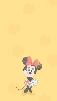 a cartoon mouse with a red bow on its head standing in front of a yellow background