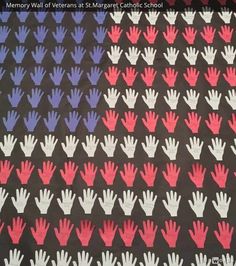 an american flag and hand prints on a black table cloth with red, white, and blue designs