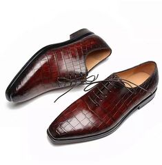 Introducing our exquisite Handmade Men Brown Crocodile Leather Oxford Shoes, the epitome of sophistication and style. These formal dress shoes are meticulously handcrafted to perfection, making them a must-have addition to any gentleman's wardrobe. 
Crafted from the finest quality leather, these shoes exude elegance and luxury. The upper is made from genuine crocodile leather, adding a unique and distinctive texture that sets these shoes apart from the rest. The soft calf leather lining ensures utmost comfort, allowing you to wear them for extended periods without any discomfort. 
The sole and heel are also made from genuine leather, providing durability and ensuring a long-lasting companion for your formal occasions. The attention to detail is evident in every stitch, as these shoes are a Formal Office Dress, Older Mens Fashion, Formal Dress Shoes, Crocodile Texture, Sneakers Dress, Dress Shoes For Men, Shoes Oxford, Alligator Shoes, Wingtip Shoes