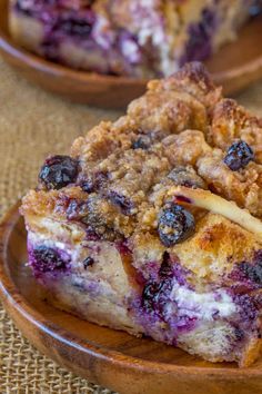 blueberry crumb cake on a wooden plate