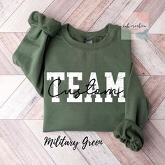 Custom Team Name Sweatshirt, Custom Best Team Ever Sweatshirt, Teammate Team Member Sweatshirt, Work Team Company Sweatshirt, Coworker Gifts Same Design on Comfort Colors Tshirt: https://www.etsy.com/listing/1789868129/comfort-colors-custom-team-name-shirt Same Design on Bella And Canvas Tshirt: https://www.etsy.com/listing/1775671950/custom-team-name-shirt-custom-teammate ❤ Gildan Brand Sweatshirts & Unisex Adult Sizing Our Unisex Heavy Blend Crewneck Sweatshirt is all about cozy comfort and effortless style. Made from a lovely blend of polyester and cotton, it keeps your favorite designs looking fresh and beautiful. The absence of itchy side seams means you'll stay cozy and irritation-free. Perfect for layering or wearing on its own, this sweatshirt is your go-to for a relaxed, feminine Cheap Sports Fan Sweatshirt With Team Name, Cheap Sweatshirt With Team Logo For Fans, Cheap Crew Neck T-shirt With Team Name, Casual Sweatshirt With Team Name For Team Events, Green Crew Neck T-shirt For Team Events, Pre-shrunk Crew Neck Sweatshirt For Team Events, Long Sleeve T-shirt With Letter Print For Team Events, Cotton Crew Top With Team Name, Cotton Crew Neck Top With Team Name