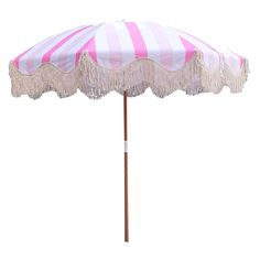 a pink and white striped umbrella with fringes