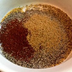 spices in a white bowl on a table