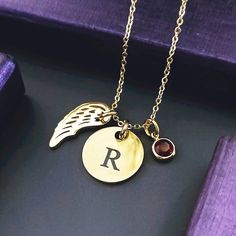 Our Memorial Angel Necklace with Birthstone Charm is a touching way to keep a loved one close to your heart. This necklace features three pendants that symbolise hope, faith, and love, and the half wings indicate that your loved one is now your angel, watching over you from above. With the option to inscribe the initials of your loved one on the round disc pendant, this necklace is a unique and meaningful way to honor their memory. The birthstone adds a personal touch, and you can choose from si Tarnished Silver Jewelry, Remembrance Jewelry, Your Guardian Angel, Mini Necklace, Angel Necklace, Tarnished Silver, Memorial Necklace, 21st Gifts, Disc Pendant