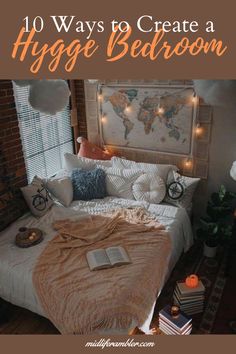 a bed with pillows and blankets on top of it in front of a wall map