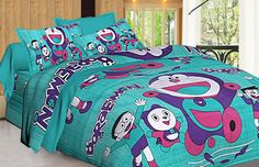 a bed covered in blue and pink comforters with cartoon characters on it, sitting next to a window