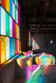 the sun shines through colorful stained glass windows