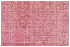 a pink rug with small squares on the bottom, and an over - sized pattern