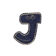 the letter j is made out of blue sequins and has a white background