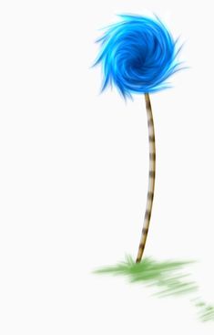 a blue feathered flower on top of a green grass covered field and white background