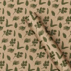 the fabric has green leaves on it and is very light beige with brown dots in the background