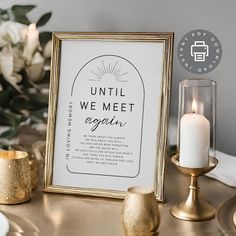 a table with candles, flowers and a sign that says until we meet again