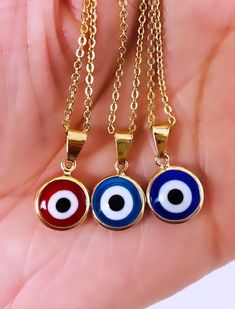 🌸Our Evil Eye Jewelry is made with 3%(1/30) gold content using 18Kt. The base metal for this type of jewelry is brass. Gold Filled is a great quality alternative to solid gold. Items labeled gold filled with proper care and storage have a durability life of over 1 Year. This evil eye necklace protects you away from Evil and bad things. A beautiful round rainbow blue eye pendant is suitable for many occasions! Beautiful as a gift. 🌸 All pieces available are delicate. Simple and elegant. A perfe Gold-tone Chain Necklace As A Gift, Gold-tone Round Chain Necklace For Gift, Gold Plated Round Necklace For Good Luck, Gold Round Chain Necklace Gift, Gold Round Chain Necklace As Gift, Gold Evil Eye Pendant Charm Necklace, Gold Evil Eye Round Jewelry, Metal Evil Eye Necklace With Round Shape, Evil Eye Metal Necklace With Round Shape