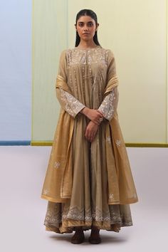 Beige anarkali featuring silk thread embroidered mughal floral, paisley and applique jharokha motifs, embellished by sequins and Swarovski crystals. Comes with churidar and dupatta. - Aza Fashions Anarkali Set With Resham Embroidery In Tissue Silk, Anarkali Traditional Wear For Reception In Tussar Silk, Art Silk Anarkali Set With Chikankari Embroidery, Floor-length Tussar Silk Anarkali Set With Cutdana, Eid Tussar Silk Anarkali Set With Resham Embroidery, Tussar Silk Anarkali With Dabka Work, Anarkali Tussar Silk Sharara With Dabka Work, Tussar Silk Anarkali Set With Sheer Dupatta For Eid, Festive Tussar Silk Anarkali Set For Reception