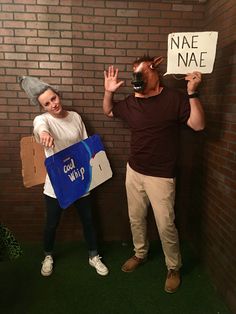 two people dressed up as donkeys and one is holding a sign that says nae nae