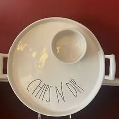 a white bowl with the word capstory written on it