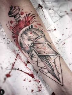 a black and white tattoo design on the arm