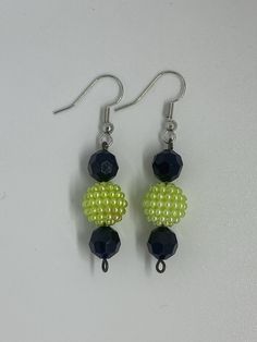 Material: Metallic Color: Lime green bead with black beads Type: Earrings Style: Glamorous Trendy Black Beaded Earrings, Trendy Black Dangle Beaded Earrings, Trendy Black Beaded Earrings For Gift, Green And Black Beaded Earrings For Gifts, Green Beaded Earrings With Black Beads For Gift, Trendy Green Beaded Drop Earrings, Trendy Black Beaded Earrings For Party, Green Earrings, Metallic Colors