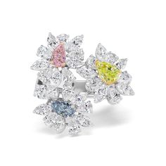 High jewelry meets fun and contemporary with this multi-stone flower ring. White diamonds blossom around Fancy colored diamonds to display a delicate, sculptural look crafted to stand out. 0.31CT Pear Shape Fancy Pink Diamond - SI1 Clarity, GIA#5211317622 0.34CT Pear Shape Fancy Blue Diamond - SI2 Clarity, GIA#2171888908 0.78CT Pear Shape Intense Yellow Green Diamond - SI2 Clarity, GIA# 2171459074 4.68CT Pear Shape and Marquise Natural White Diamonds Luxury Elegant Multi-stone Flower Ring, Luxury Multi-stone Diamond Ring, Fancy Pink Diamond Ring, Fancy Color Diamond Ring, Fancy Diamond Ring, 2024 Color, Pink Diamond Ring, Colored Diamond Rings, Pear Shaped Ring