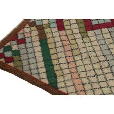 a multicolored area rug is shown on a white background