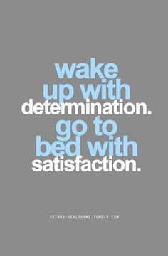 the words wake up with determination go to bed with satisfaction on grey and blue background