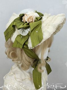 Add a touch of whimsical charm to your outfit with our delightful straw bonnet. Available in a range of colors including blue, green, beige, and pink, each bonnet features delicate flower details that capture the essence of cottagecore style. This versatile accessory is perfect for completing a sweet and romantic look.   Please note that the product includes only the straw bonnet. Elegant Adjustable Cream Bonnet, Spring Cream Hat With Ribbon, Elegant Bonnet For Spring, Vintage Green Mini Hats For Spring, Feminine Cream Hat For Spring, Elegant Cream Bonnet For Spring, Spring Beige Hat With Ribbon, Adjustable Beige Bonnet For Spring, Vintage Cream Bonnet