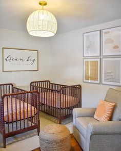 a baby's room with two cribs in it