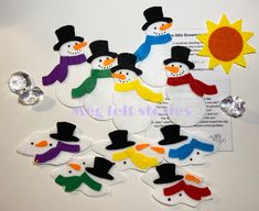 felt snowmen with hats, scarfs and sun