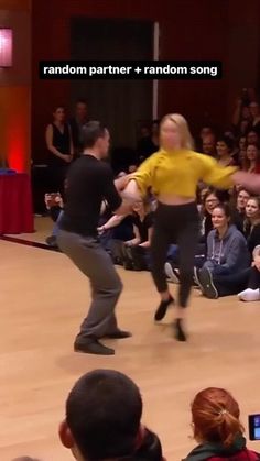 two people are dancing in front of an audience at a dance show with the caption random partner + random song