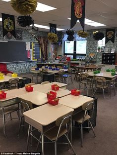 a classroom filled with desks and chairs covered in red tissue paper bags on top of them