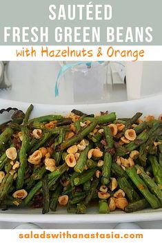 sauteed fresh green beans with hazelnuts and orange in a serving dish