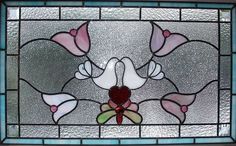 a stained glass window with flowers on it