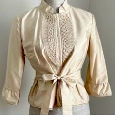 Gorgeous In Excellent Condition Size Medium Ladies 3/4 Sleeve 100% Silk With Beautiful Lace Up Bust Line And Light Ruffle Around Bottom And End Of Sleeve Spring Silk Stretch Top, Spring Beige Stretch Blouse, Beige Stretch Blouse For Spring, Stretch Beige Blouse For Spring, Spring Silk Stretch Blouse, Cream Stretch Blouse For Spring, Fitted Silk Tops For Spring, Fitted Beige Top For Formal Occasions, Formal Fitted Beige Top