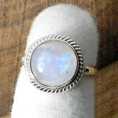 Rainbow Moonstone Ring, Moonstone Ring, Moonstone Jewelry, Round Moonstone, Handmade Silver Ring, 925 Sterling Silver Ring, Rainbow Ring. Description : Gemstone : Rainbow Moonstone Metal : 925 Sterling Silver Stone Shape :- Round Stamp :- 925 Weight : 4.90 Gram Approx Stone Size : 11 MM Approx handmade Item Made to order **This ring you will receive may vary from the image as no two gemstones are similar and images cannot define exact product definitions. ** Shipping Policy:- We mainly use UPS , Handmade Moonstone Crystal Ring, Handmade Moonstone Ring With Round Stone, Moonstone Birthstone Ring, Handmade Round Moonstone Ring, Bohemian Moonstone Birthstone Ring, White Moonstone Ring With Mystical Style, Mystical Moonstone Birthstone Ring, Sterling Silver Round Moonstone Ring With Moon Phase, Handmade Mystical Round Moonstone Ring