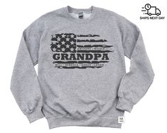 a grey sweatshirt with an american flag and the words grandpa written in black on it