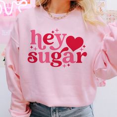 Get cozy and spread some love with our Hey Sugar Heart Sweatshirt in Pink! This long sleeve sweatshirt features a playful "hey sugar" saying and a big red heart with pink sparkles. Perfect for staying warm and showing some Valentine's Day spirit. Size Suggestions: Small: 2-4 Medium: 6-8 Large: 10-12 XL: 14-16 2XL: 18-20 3XL: 22-24 Care Instructions: Machine wash, cold. Tumble dry, low. Do not iron decoration. SKU: #243424-DS LC Holiday Outfits Modest, Simple Holiday Outfits, Modest Holiday Outfits, Women Holiday Outfits, Holiday Outfits Casual, Pink Panache Jewelry, Sassy Shortcake, Casual Holiday Outfits, Holiday Outfits Summer