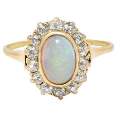 an opal and diamond cluster ring