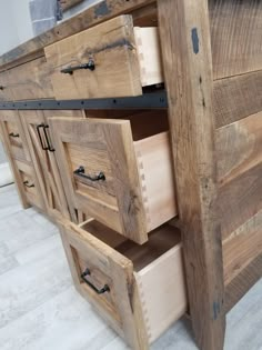 a wooden dresser with drawers on top of it