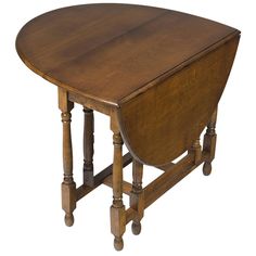 an old wooden table with two legs and a curved top on one end, against a white background