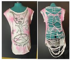 two different views of the same t - shirt on mannequins, one with an abstract design