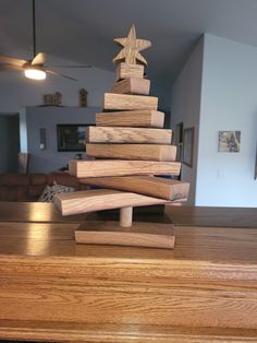 a wooden christmas tree on top of a table