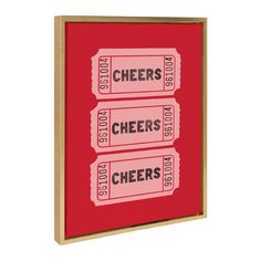 two red and white boxes with cheers on them are hanging from a wooden frame against a white background