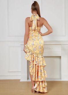 Elevate your wardrobe with our Floral Print Ruffle Hem Tassel Decor Dress. This stunning yellow maxi dress features a flattering halter-neck, delicate satin fabric, and feminine ruffle hem. The beautiful floral print and playful tassel details add a touch of Bohemian elegance. Perfect for any occasion, this dress will make you feel confident and stylish. Fabric: Slight Stretch Material: Polyester Fiber Yellow Ruffle Hem Maxi Dress For Spring, Spring Satin Halter Dress, Feminine Yellow Sleeveless Maxi Dress, Chic Halter Neck Maxi Dress With Ruffle Hem, Feminine Yellow Fitted Maxi Dress, Satin Maxi Dress For Garden Party, Feminine Fitted Yellow Maxi Dress, Chic Yellow Maxi Dress With Ruffle Hem, Fitted Yellow Feminine Maxi Dress