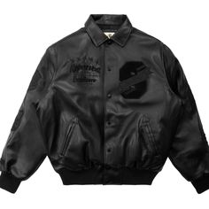 a black leather jacket with patches on it