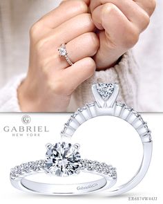 a woman's hand holding a diamond ring with the words gabriel fine jewelry