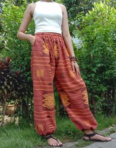 "The harem style trousers made from cotton fabric 100%with an elasticated smock waist and ankles they provide a comfortable lightweight fit, perfect for casual wear, festivals, yoga, holidays as well as pairing with a plain top to get that popular look. Materials: Soft Cotton Sizing: One size fits most. Size : (inches) ✿Waist : 22-42 inch ( 55-106 cm ) ✿ Hip :up to 49 inch ( 124 cm) ✿ Length 40\" ( 101 cm ) ✿2 sides pockets S I Z E : US SIZE 4 - 12 , UK SIZE 8 - 16 , EU SIZE 36 - 44 MODEL SIZE : Bohemian Hip-length Harem Pants For Festival, Multicolor Wide-leg Bohemian Harem Pants, Hippie Loose-fit Multicolor Harem Pants, Fitted Bohemian Full-length Harem Pants, Multicolor Boho Print Wide-leg Harem Pants, Style Trousers, Harem Pants Women, Hippie Clothes, Yoga Clothing