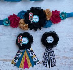 three ribbons with different designs on them sitting next to each other in front of a white background